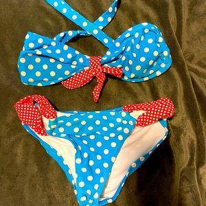 Blue polkadot bikini with red bow tie